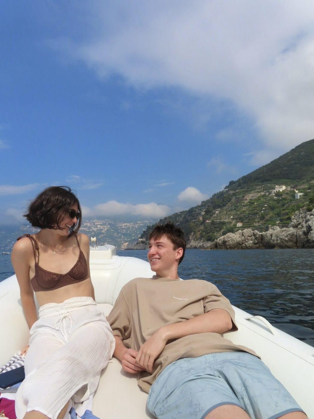 Relaxing on the boat with the Amalfi coastline behind us