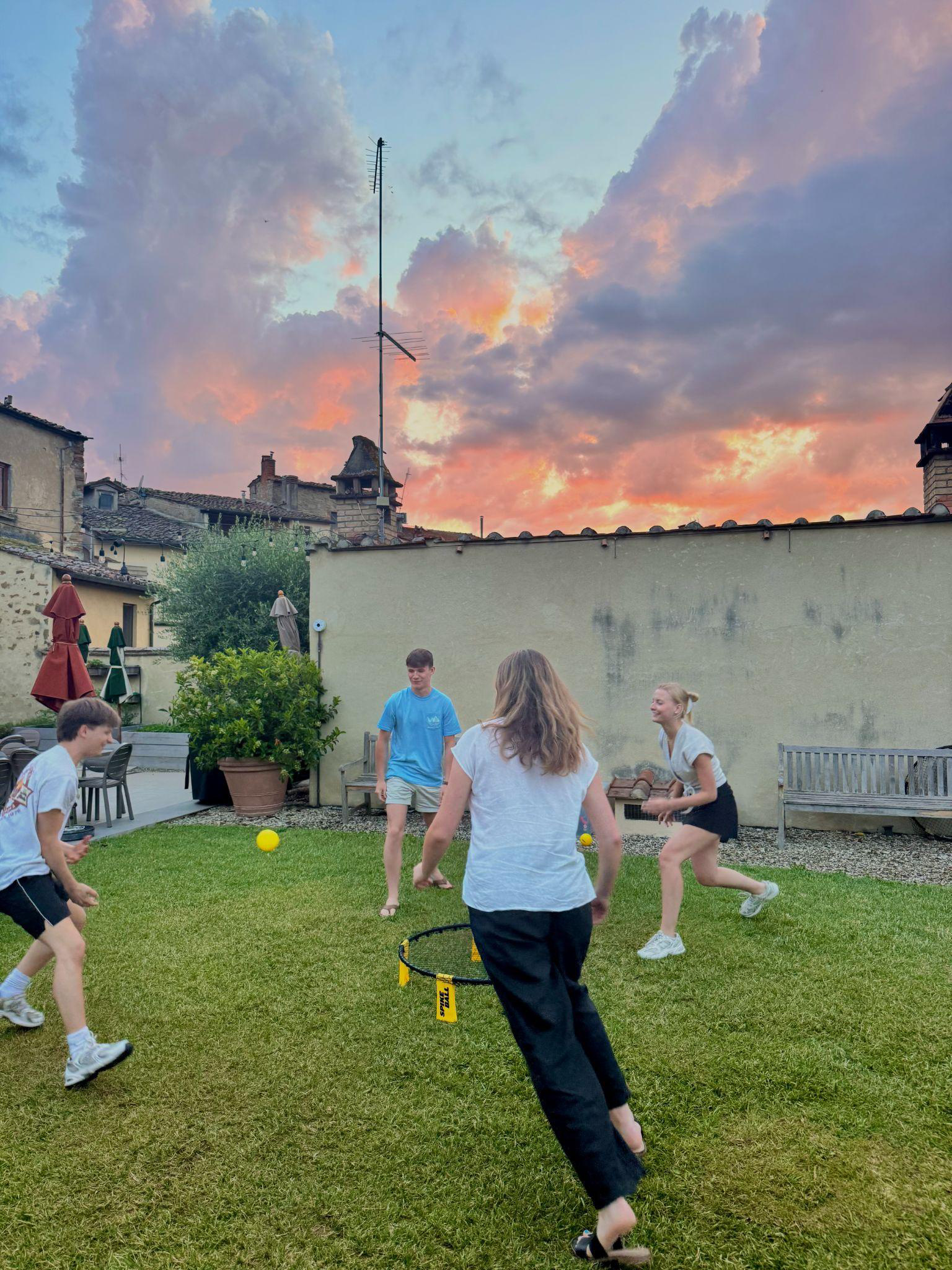 Playing games in the garden at sunset