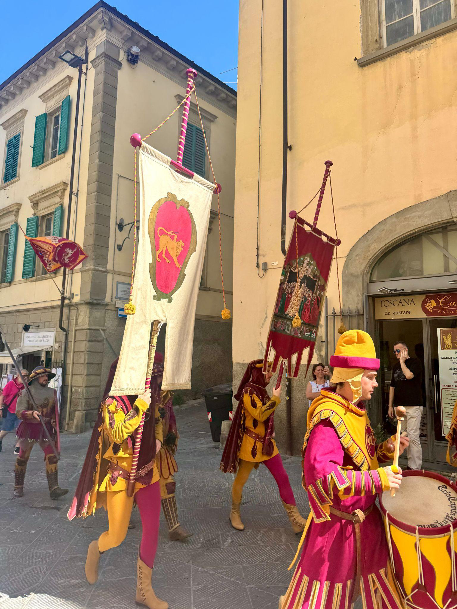 Performers in costume parading before the joust