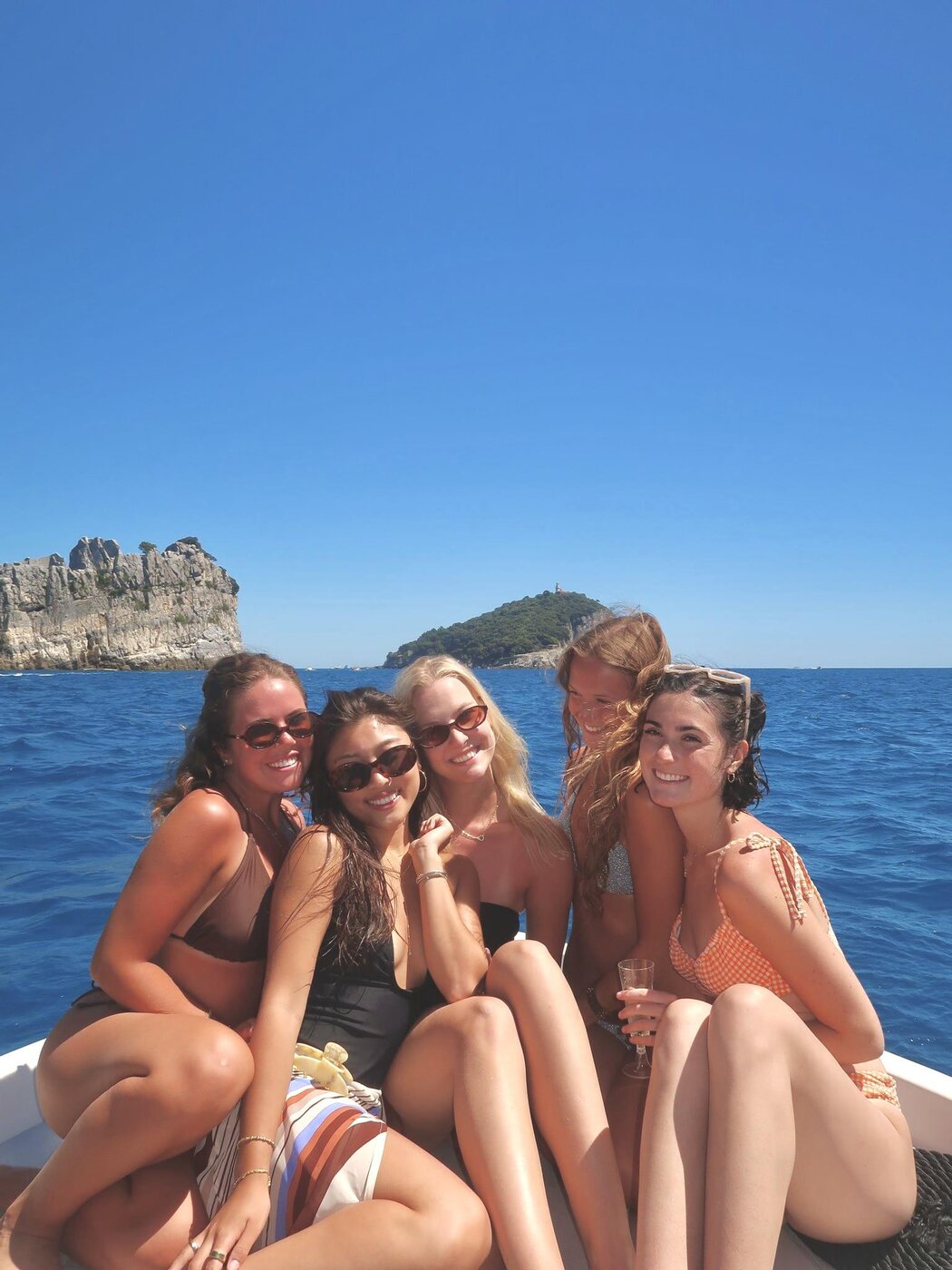 The group on the bow of the boat