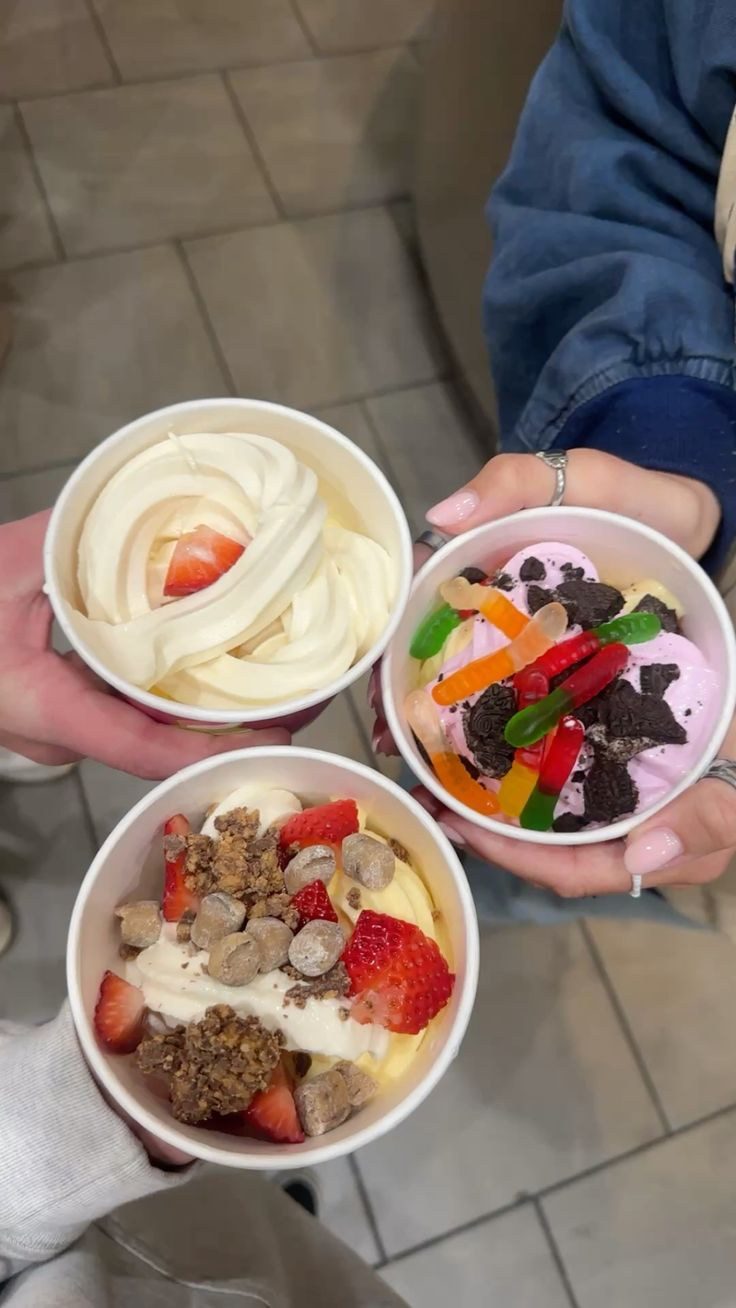Three of us holding our finished froyo cups together