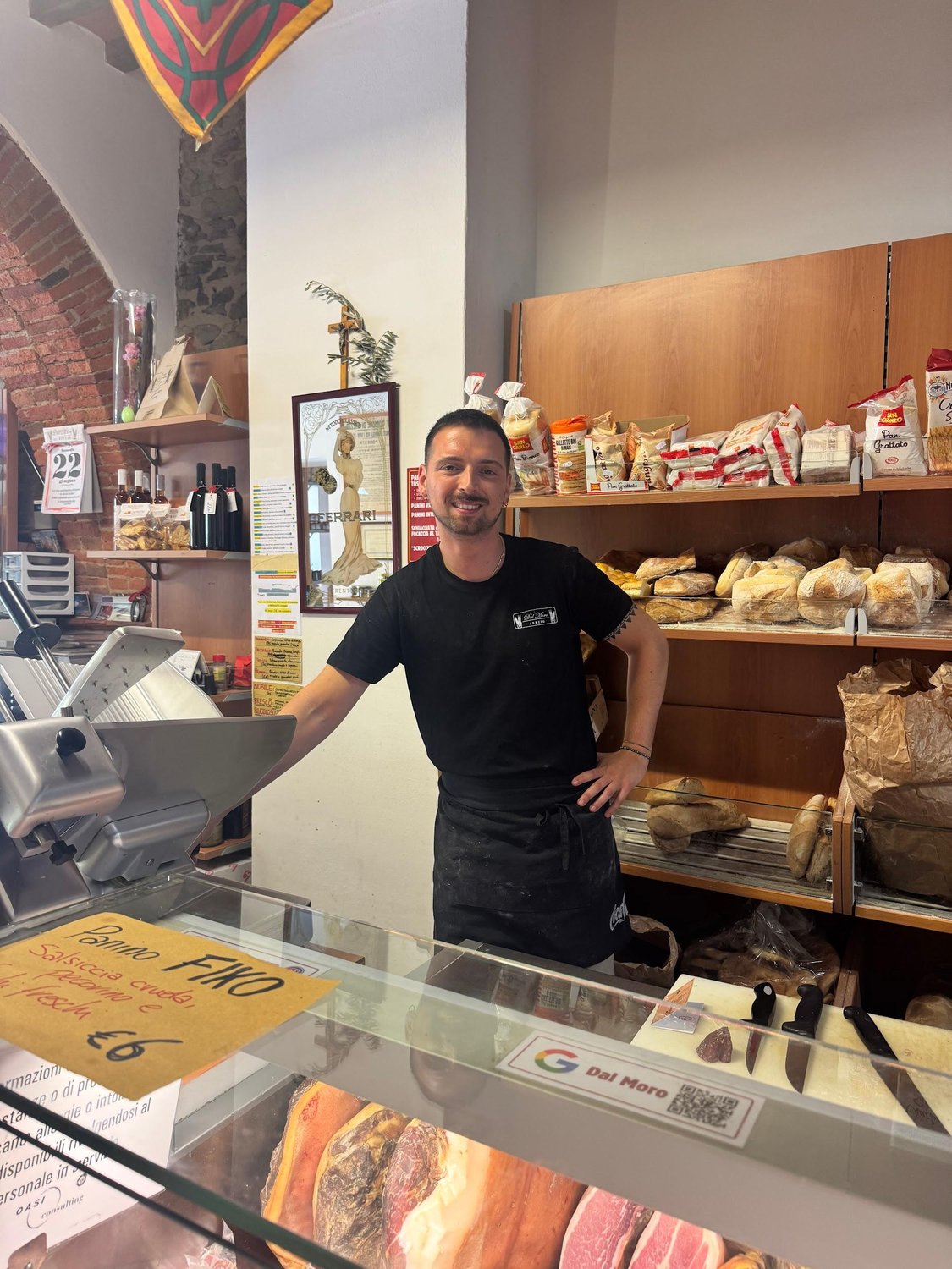 Ricardo smiling behind the counter at Dal Moro