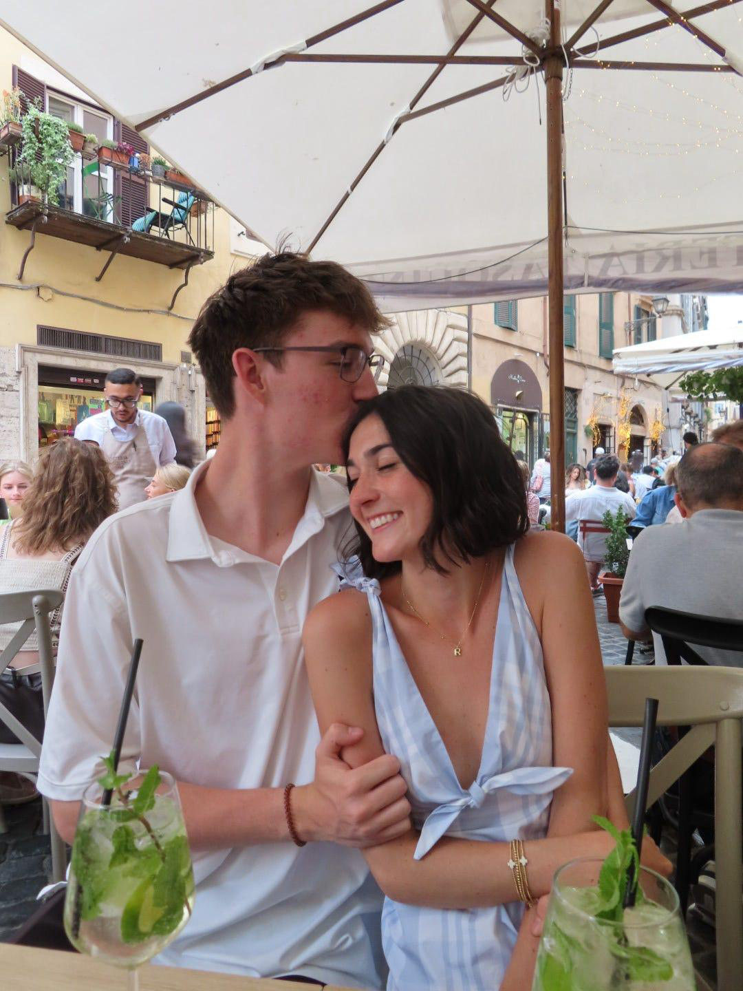 Morgan and Seth sharing a moment over spritzes at the birthday dinner