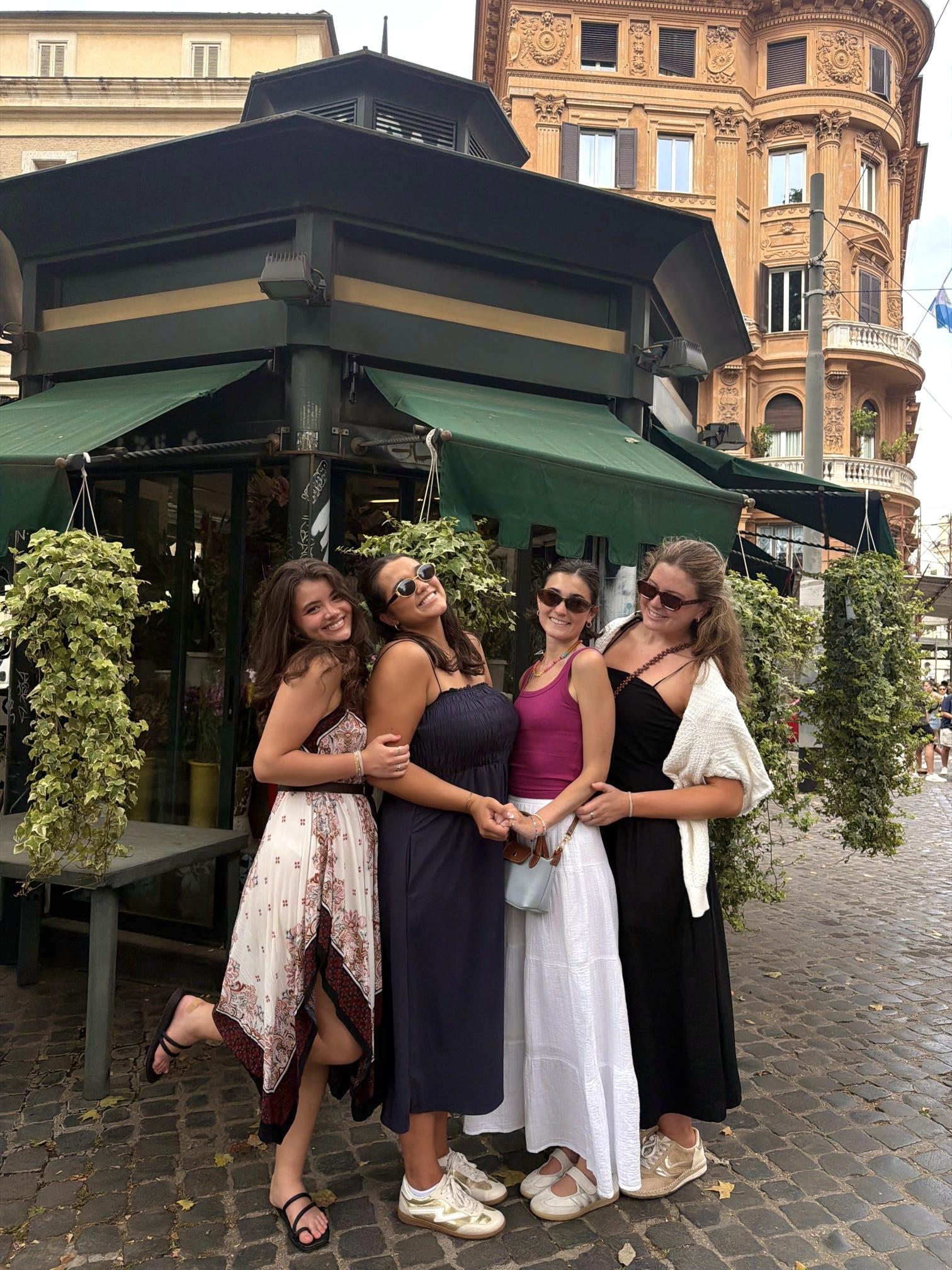 Four of us posing outside a restaurant in Rome