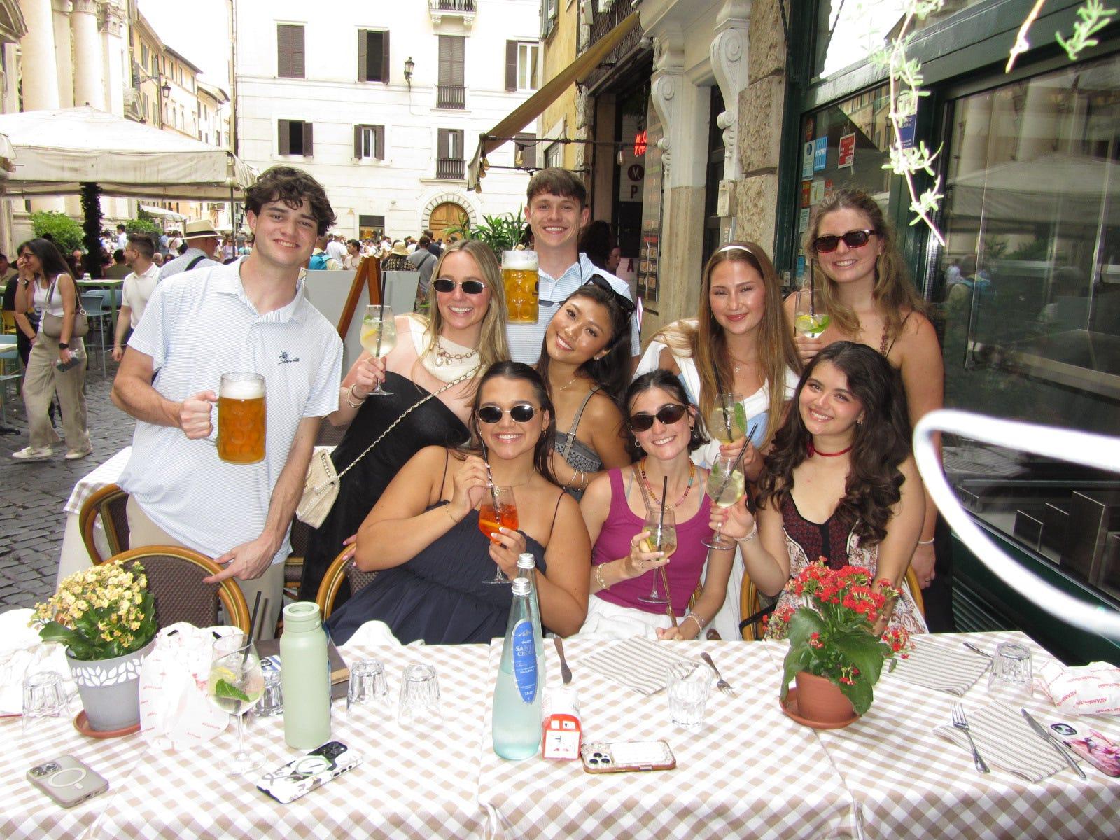 The group gathered around a restaurant table with drinks